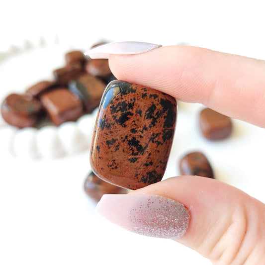 Mahogany Obsidian Tumbled Stones In Hand