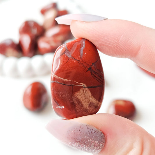 Red Jasper Tumbled Stones In Hand