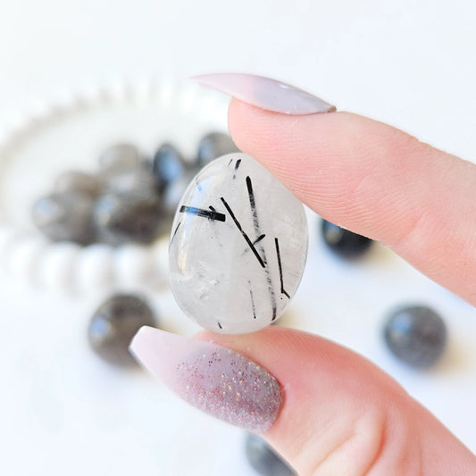 Tourmalinated Quartz Tumbled Stones In Hand