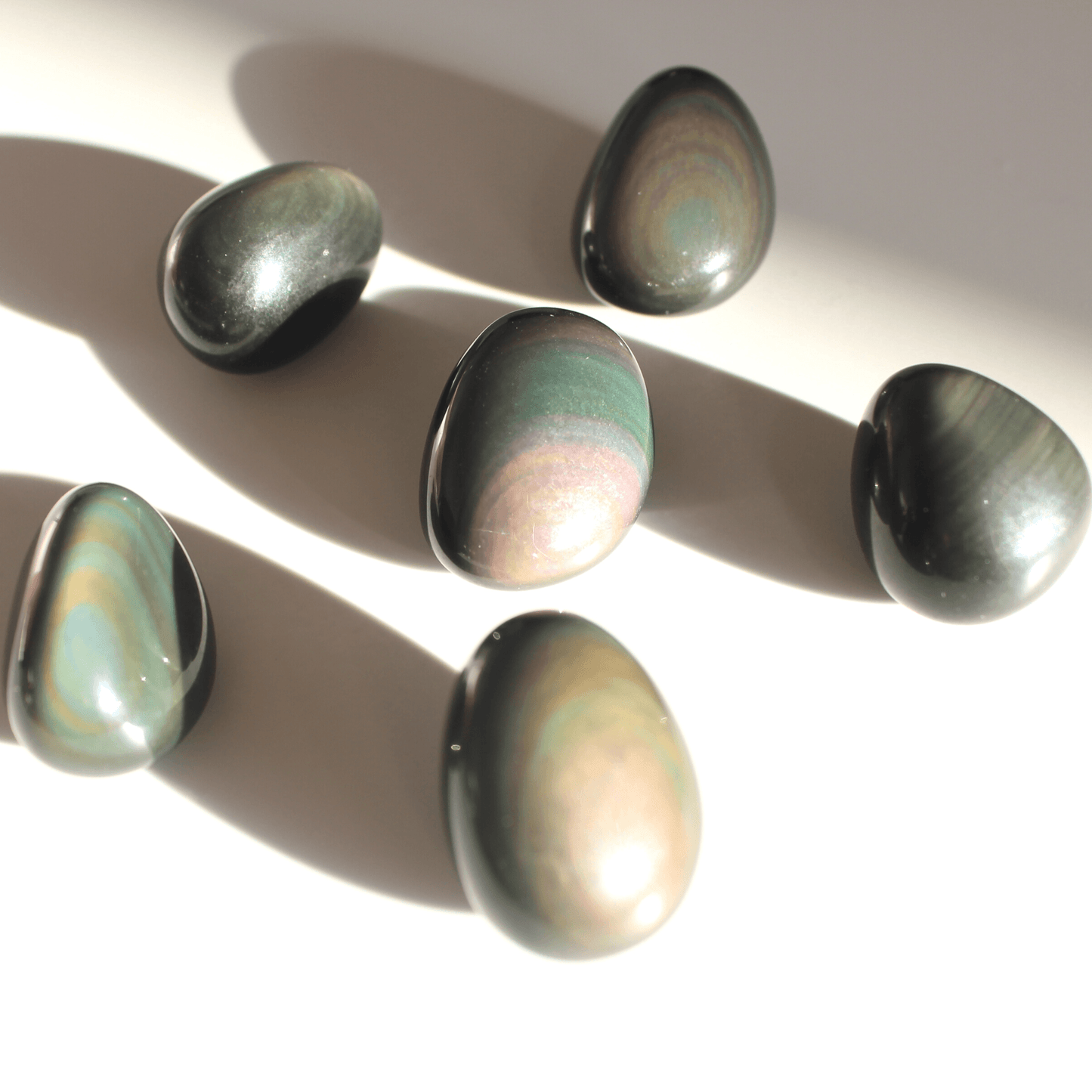 Rainbow Obsidian Tumbles in Light